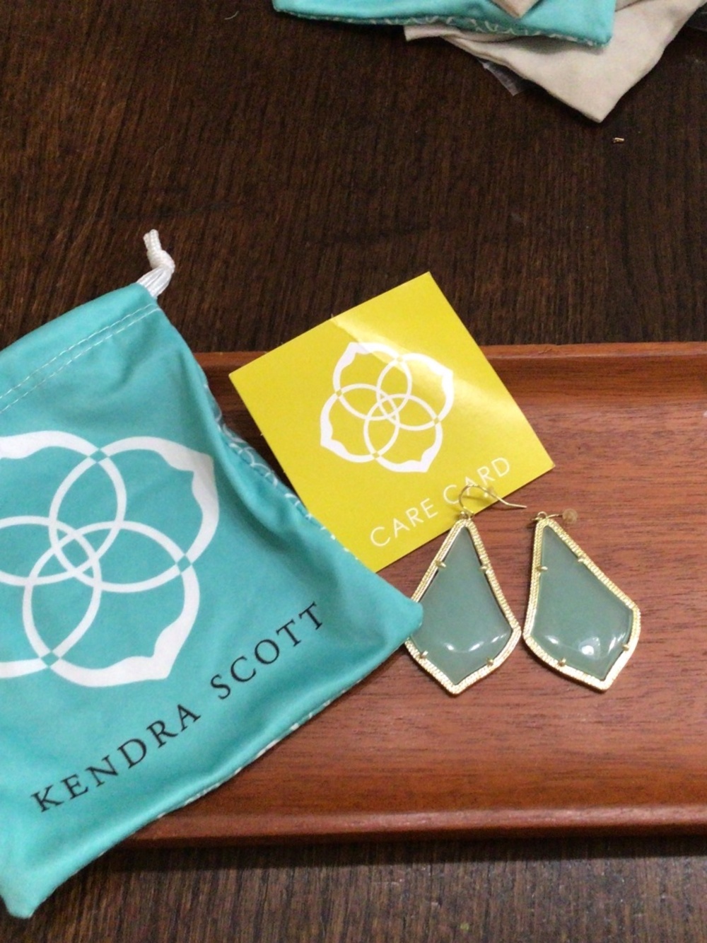 Kendra Scott, Ellie drop earrings. Sage in color, beaded Bezel gold tone frames